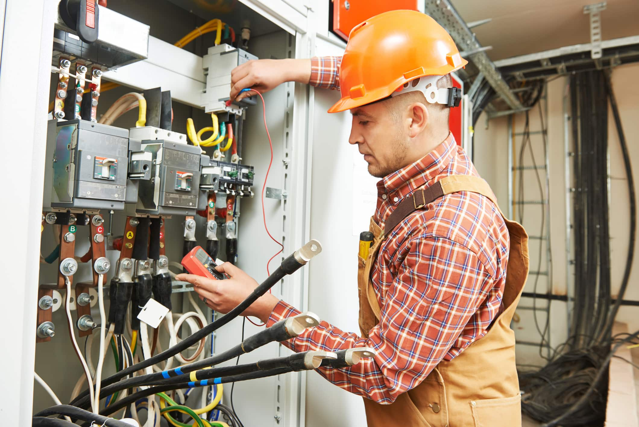 An electrician snipping wires